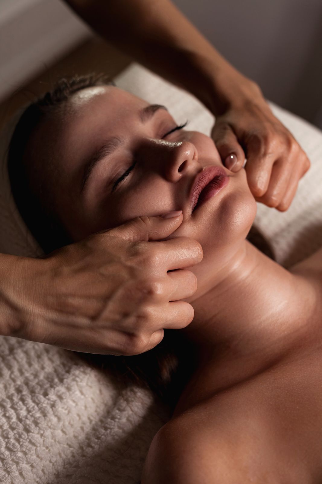 Woman relaxing during a gentle professional facial treatment