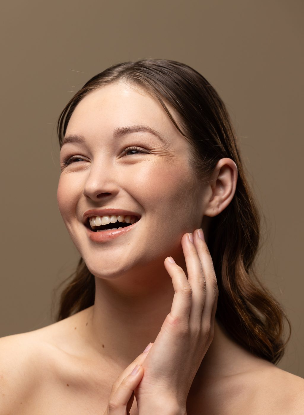 Smiling woman with glowing skin